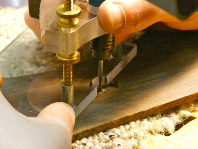Cutting the pearl and inlaying the headstock